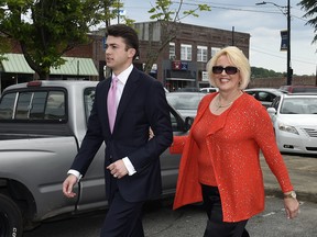 Brooke Covington, a member of the Word of Faith Fellowship church in Spindle, N.C., leaves a hearing on May 19, 2017 accompanied by attorney, Joshua Valentine