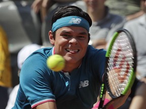 Canada's Milos Raonic returns the ball to Czech Republic's Tomas Berdych during their match at the Italian Open tennis tournament in Rome on Thursday, May 18, 2017.