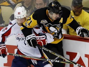 Evgeny Kuznetsov, left, of the Washington Capitals, rubs out Evgeni Malkin of the Pittsburgh Penguins during Game 6 action in their Eastern Conference semifinal Monday in Washington. The Caps were 5-2 winners, forcing a Game 7 Wednesday night in Washington.
