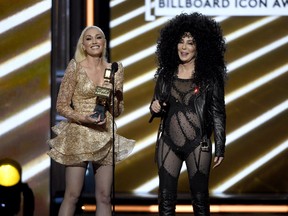 Gwen Stefani, left, presents the Billboard Icon award to Cher at the Billboard Music Awards at the T-Mobile Arena on Sunday, May 21, 2017, in Las Vegas.