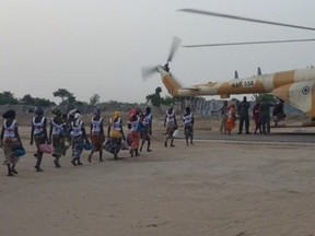 Some of the 82 Nigerian schoolgirls board a helicopter after their release, according to the International Committee of the Red Cross.