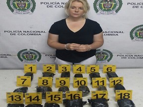 This April 12, 2017 photo released by Colombia's National Police press shows Australian Cassandra Sainsbury in handcuffs after she was arrested at the international airport in Bogota, Colombia. According to police, an x-ray machine detected almost six kilograms of cocaine hidden in packages stashed in her luggage as the 22-year-old was preparing to board a flight to London on her way back to Australia.