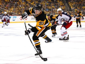 Pittsburgh Penguins forward Jake Guentzel shoots against the Columbus Blue Jackets on April 20.