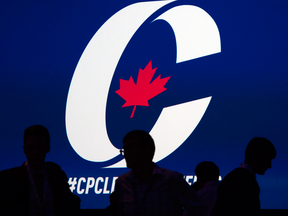 Supporters take their seats during the opening night of the federal Conservative leadership convention in Toronto on May 26, 2017.