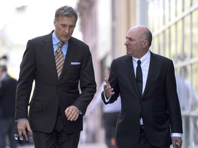 Conservative Party leadership candidate Maxime Bernier, left, and Kevin O'Leary walk together after an interview in Ottawa on Tuesday, May 16, 2017.