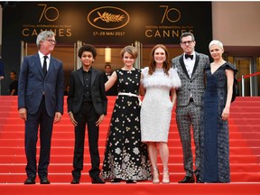 (From left) U.S. director Todd Haynes, U.S. actor Jaden Michael, U.S. actress Millicent Simmonds, U.S. actress Julianne Moore, U.S. writer/screenwriter Brian Selznick and U.S. actress Michelle Williams leave on May 18, 2017 following the screening of the film 'Wonderstruck' at the 70th edition of the Cannes Film Festival in Cannes, southern France.