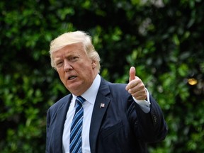 U.S. President Donald Trump makes his way to board Marine One on the South Lawn of the White House in Washington, DC on May 4, 2017.