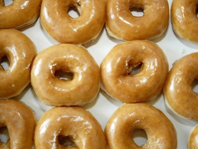 The doughnut is nearly a perfect thing: chewy but with a hint of crisp; sweet but light; designed to be dipped, topped, dusted and sprinkled. The innovation is built in! Why must we take it to grotesque extremes? Shown, a box of perfectly acceptable glazed doughnuts at a Krispy Kreme in Charlotte, North Carolina, in 2004.