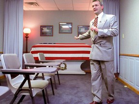 William Zwicharowski, mortuary branch chief at Dover Air Force Base in Delaware, talks with the press during a tour of the mortuary in 2003