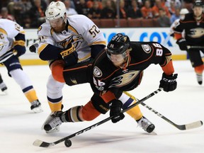 Matt Irwin, left, of the Nashville Predators, knocks Ondrej Kase of the Anaheim Ducks to the ice during Game 2 action in their Western Conference Final Sunday in Anaheim. The Ducks won 5-3 to even the series at a win apiece with Game 3 slated for Nashville on Tuesday night.