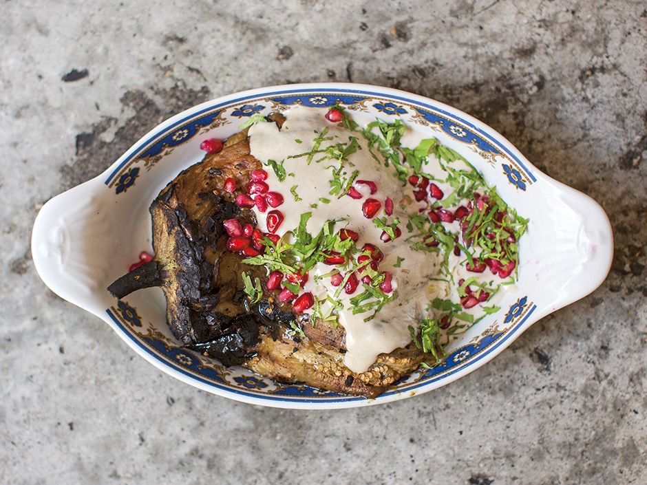 Cook this Burned eggplant with tahini and pomegranate from the Palomar