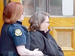 Former nurse Elizabeth Wettlaufer leaves the courthouse in Woodstock, Ontario on April 21, 2017 to face charges of multiple murders in the deaths of area senior citizens.