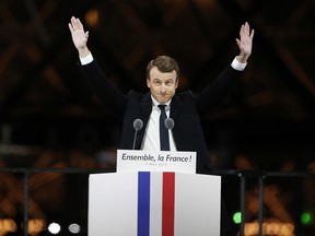 French President-elect Emmanuel Macron gestures during a victory celebration outside the Louvre museum in Paris, France, Sunday, May 7, 2017.