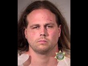 This booking photo provided by Multnomah County Sheriff's Office shows Jeremy Joseph Christian. Authorities on Saturday, May 27, 2017 identified Christian as the suspect in the fatal stabbing of two people on a Portland light-rail train in Oregon.