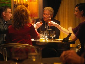 Steve Coogan, left, Richard Gere, center, and Rebecca Hall, right, in a scene from The Dinner.