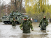 Canadian Forces personnel wade through the flooded streets, Monday, May 8, 2017 in Deux-Montagnes, Quebec.