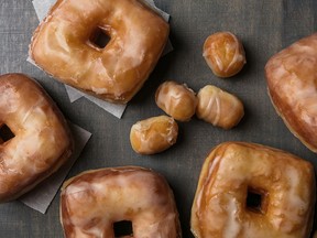 Vanilla-Glazed Brioche Doughnuts and holes, glazed and ready to eat.