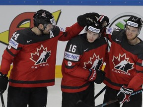 Canadian forward Mitch Marner (centre) celebrates one of his goals against Finland on May 16.