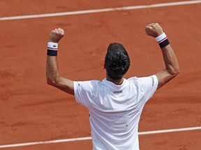Serbia's Novak Djokovic celebrateS his three set win, 6-3, 6-4, 6-2, over Spain's Marcel Granollers in the first round match of the French Open tennis tournament at the Roland Garros stadium, in Paris, France. Monday, May 29, 2017