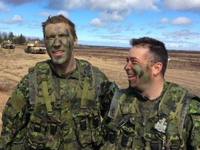 The likelihood of a Russian smear campaign is so great that Lt.-Col. Wade Rutland (left) and Sergeant-Major Michael Forest do not think that their troops will be allowed to be out on their own in Latvia