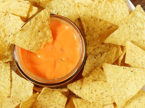 One of at least 10 people apparently sickened by nacho-cheese dip sold at a California gas station has died, health officials said Monday