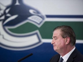 In this April 10 file photo, Vancouver Canucks general manager Jim Benning is shown at a news conference.