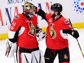 Ottawa Senators goalie Craig Anderson (left) celebrates a win over the New York Rangers with centre Derick Brassard on April 27.