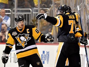 Evgeni Malkin (R) leads the playoffs in scoring. Sidney Crosby (L) is second.