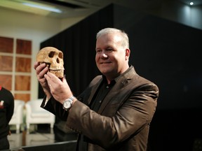 Paleoanthropologist Professor Lee Rogers Berger holds a replica of the skull of ÒNEOÓ, a newly discovered skeleton of the Homo naledi hominin species, at the Cradle of Human Kind in Maropeng near Johannesburg on May 9, 2017 in South Africa.