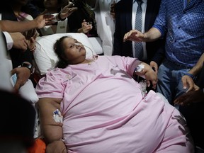 Egyptian woman Emam Ahmed who was undergoing weight-loss surgery at Mumbai's Saifee Hospital is carried on a stretcher towards an ambulance on her way to the airport in Mumbai, India, Thursday, May 4, 2017.