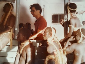 In an undated handout photo, T.N. Pandit, centre, with members of the Jarawa tribe, who are visiting a ship anchored off their land in the 1980s. Pandit, an anthropologist who studied indigenous groups and coaxed them into contact with outsiders, now agrees that the Jarawa people have been damaged by such exposure.