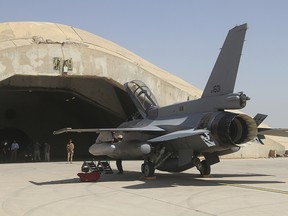 This July 2015 file photo shows one of four new U.S.- made F-16 fighter jets outside a hardened hangar upon its arrival to Balad air base, north of Baghdad, Iraq.