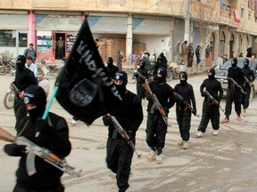 Fighters from the al-Qaida linked Islamic State of Iraq and the Levant (ISIL), marching in Raqqa, Syria.