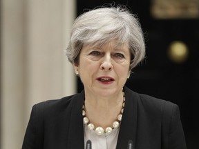 In this May 23, 2017 file photo British Prime Minister Theresa May addresses the media outside 10 Downing Street