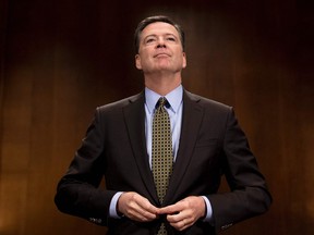 FBI Director James Comey prepares to testify before the Senate Judiciary Committee on Capitol Hill in Washington, DC on May 3, 2017. President Donald Trump on May 9 made the shock decision to fire Comey.