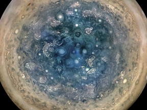 This image made available by NASA on Thursday, May 25, 2017, and made from data captured by the Juno spacecraft shows Jupiter's south pole.