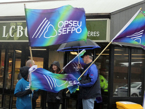 OPSEU members protest alcohol being sold in grocery stores.