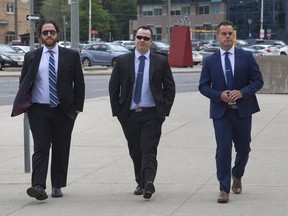 (Left to right) Daniel Spicer, Frank Boyes and Sean James arrive at the London Courthouse for the second day of their trial in London, Ont. on Wednesday May 24, 2017