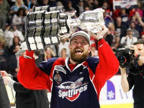 Aaron Luchuk of the Windsor Spitfires holds up the Memorial Cup after Sunday's 4-3 win over the Erie Otters in the tournament final in Windsor. Luchuk had the game-winning goal. Windsor finished 4-0 in the tournament to win its third Memorial Cup title in nine years.
