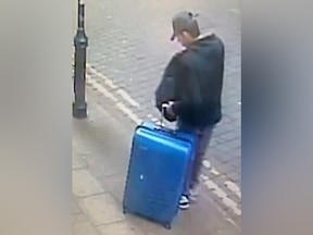A handout CCTV photograph released by Greater Manchester Police on May 29, 2017, shows Salman Abedi with a blue suitcase in the centre of Manchester on the day he committed the attack