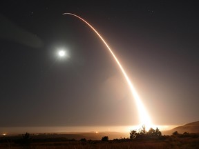 In this image taken with a slow shutter speed and provided by the U.S. Air Force, an unarmed Minuteman 3 intercontinental ballistic missile launches during an operational test just after midnight, Wednesday, May 3, 2017, at Vandenberg Air Force Base, Calif.