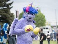 Jim McDonald, dressed as Twilight Sparkle from My Little Pony, poses outside of Cosplay at the Toronto, Congress Centre on Saturday, May 27. An anime convention and the Conservative Party of Canada leadership convention were running alongside each other in the building over the weekend.