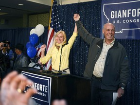 Greg Gianforte, right, and wife Susan, center, celebrate his win over Rob Quist for the open congressional seat at the Hilton Garden Inn Thursday night, May 25, 2017, in Bozeman, Mont.