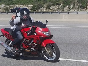 James Cole was sentenced on Monday to two years in a federal prison and banned from driving for another two years beyond that after admitting to being the motorcyclist who raced around Ottawa for several weeks last spring, flashing an imitation handgun.