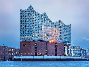 The Elbphilharmonie, a concert hall in Hamburg encased in glass and set upon a giant brick warehouse, is surrounded on three sides by the waters of the city's bustling harbour.