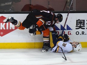 Anaheim Ducks forward Ryan Kesler (left) checks Nashville Predators forward Viktor Arvidsson on May 14.