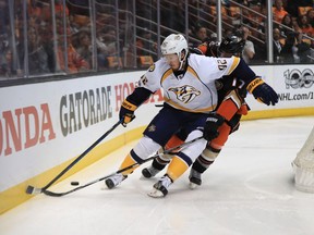 Nashville Predators forward Ryan Johansen (left) protects the puck from Anaheim Ducks forward Ryan Kesler on May 14.