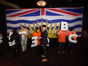 A volunteer arranges supporters holding letters to spell out 'Better BC' before an NDP campaign rally with Leader John Horgan in Vancouver, B.C., on Sunday April 23, 2017. The provincial election was held on May 9.