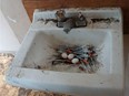 Pigeon eggs sit in a nest make entirely out of used hypodermic needles.