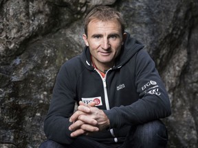 Ueli Steck poses for a photo at the foot of a climbing wall in Wilderswil, Canton of Berne, Switzerland in 2015